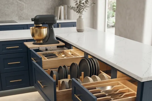 Vita drawer organizers arriving pre-installed in a navy kitchen island